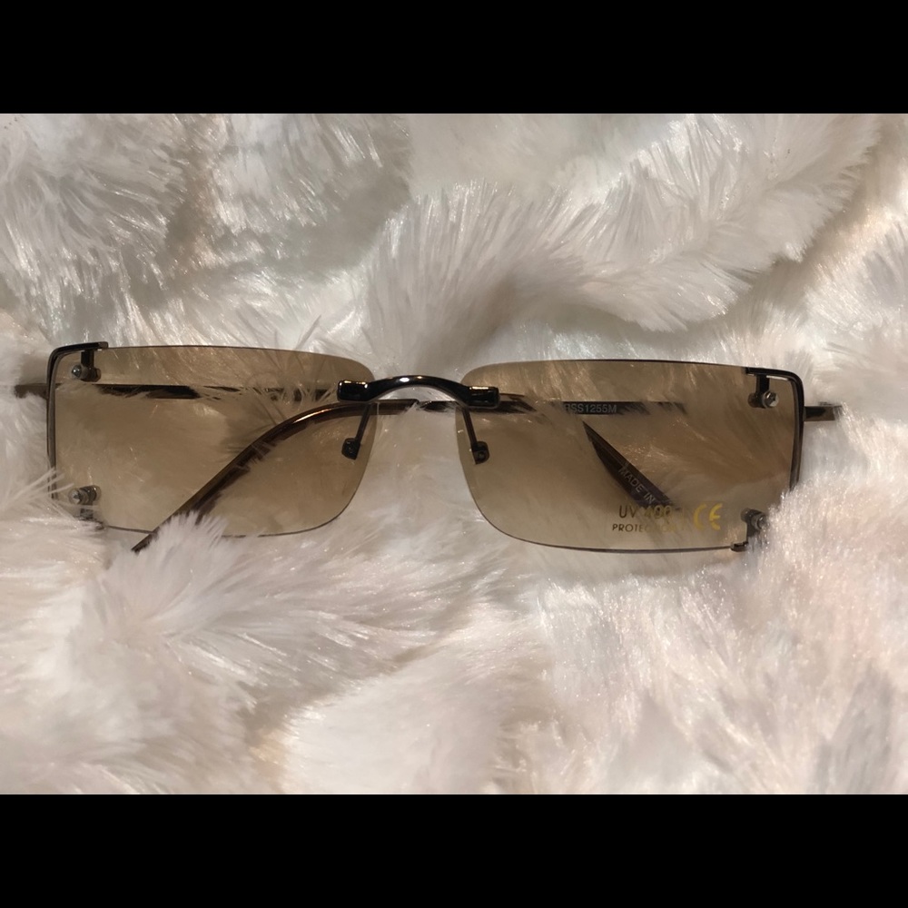 8 Tinted sunglasses with gold trim.